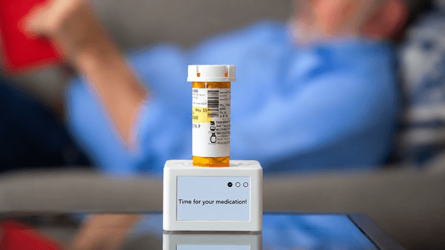 Smart Dock device on countertop with pharmacy vial